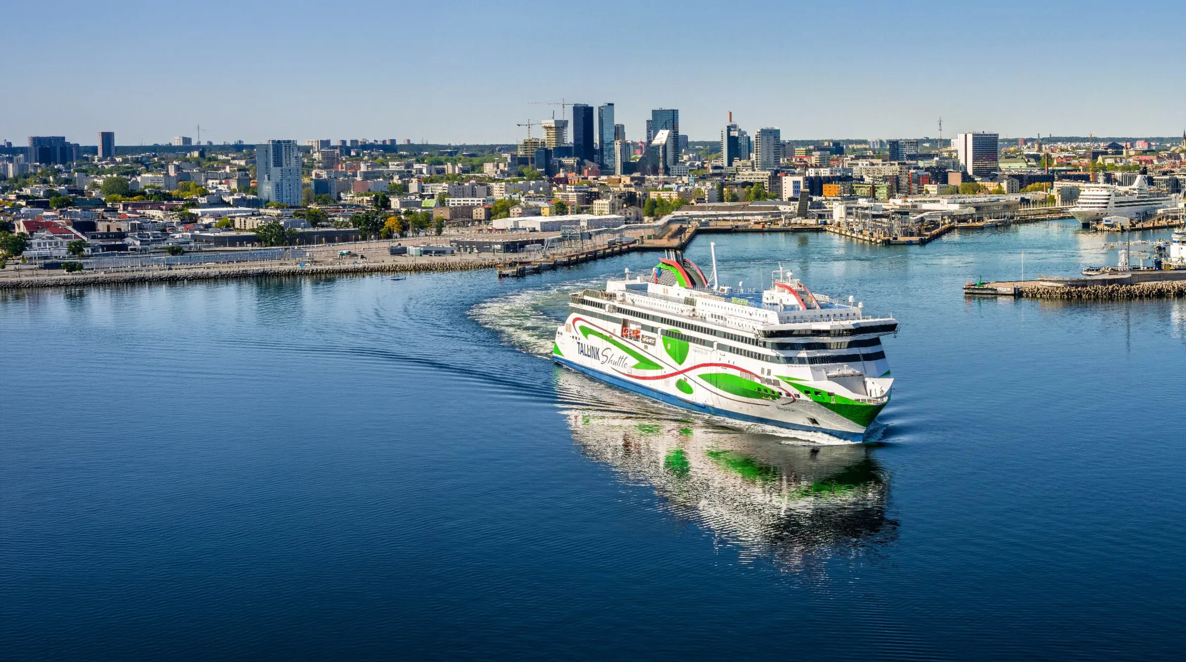 A ferry arriving in Tallinn harbour with the city skyline behind